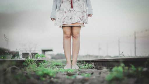 person standing wearing white dress