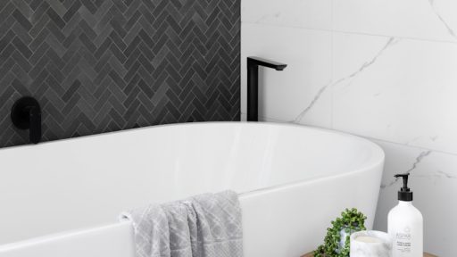 white bathtub near white ceramic bathtub