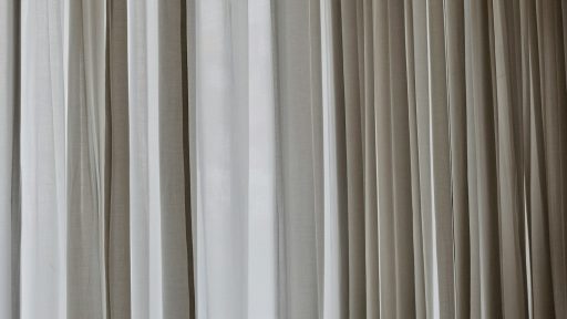 white and gray window curtain