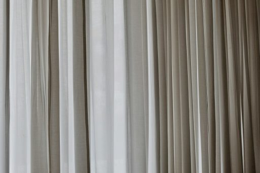 white and gray window curtain