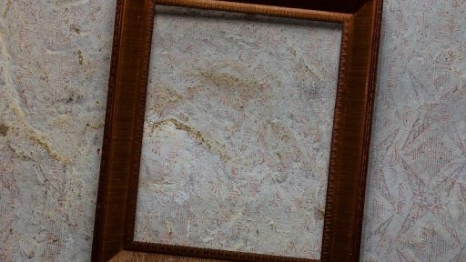 brown wooden frame on white wall