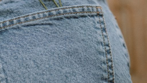 person in blue denim jeans