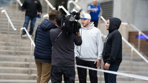 Filming a group of people on outdoor stairs