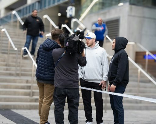 Filming a group of people on outdoor stairs